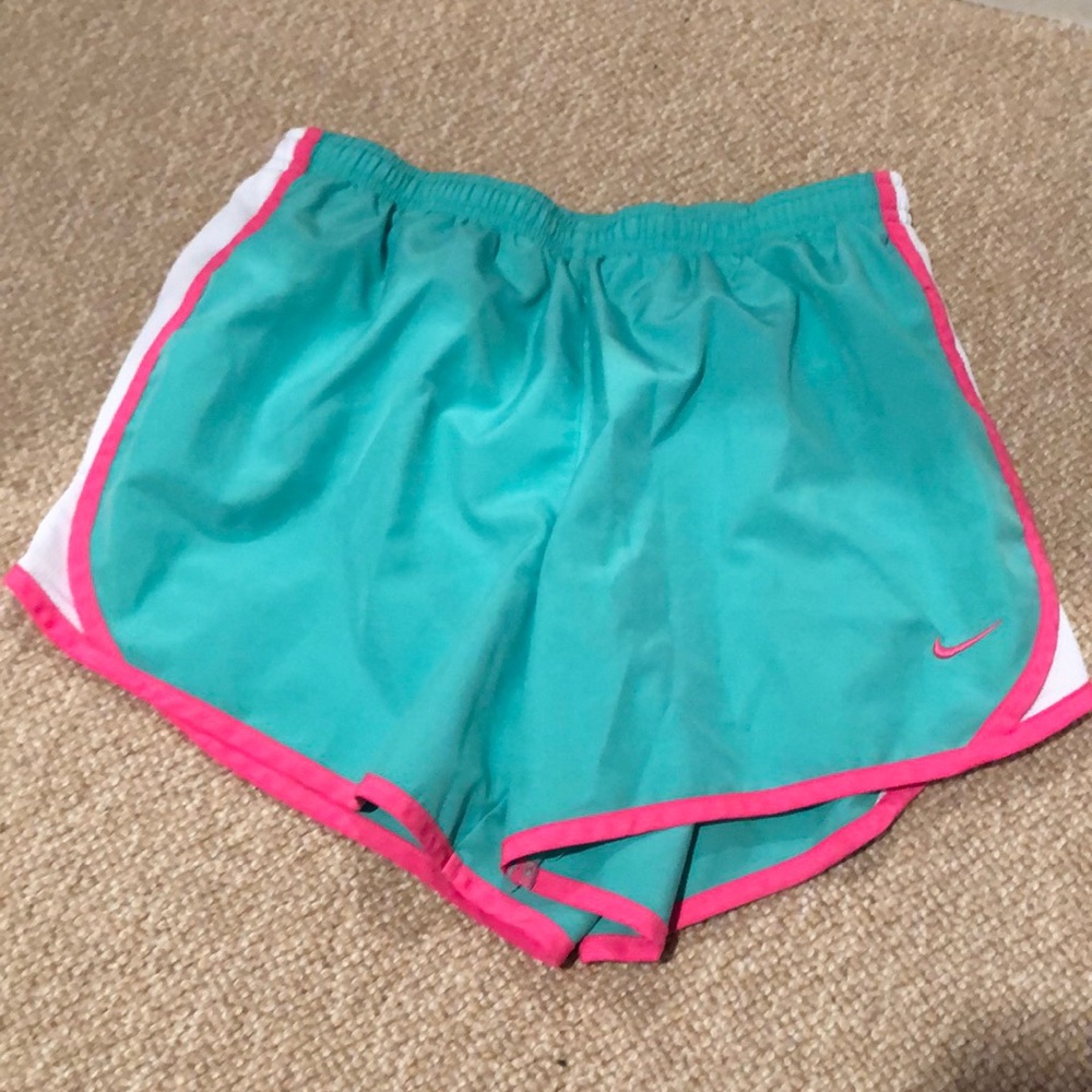 green nike shorts with pink and white sides